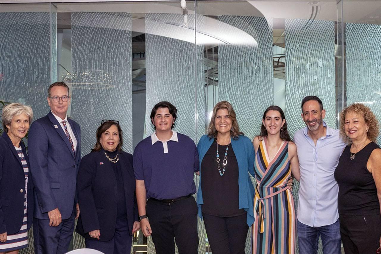 From left, Linda Medvin, director of the Arthur and Emalie Gutterman Family Center for Holocaust and Human Rights Education; Dan Davidowitz; Leah Davidowitz; Shoshana Davidowitz; Ben Davidowitz; FAU President Stacy Volnick; Michael Horswell, Ph.D., dean of the Dorothy F. Schmidt College of Arts and Letters; and Laurie Carney, senior director of development and outreach in the Dorothy F. Schmidt College of Arts and Letters.