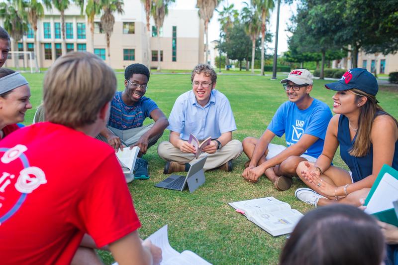 Students sitting on the grass