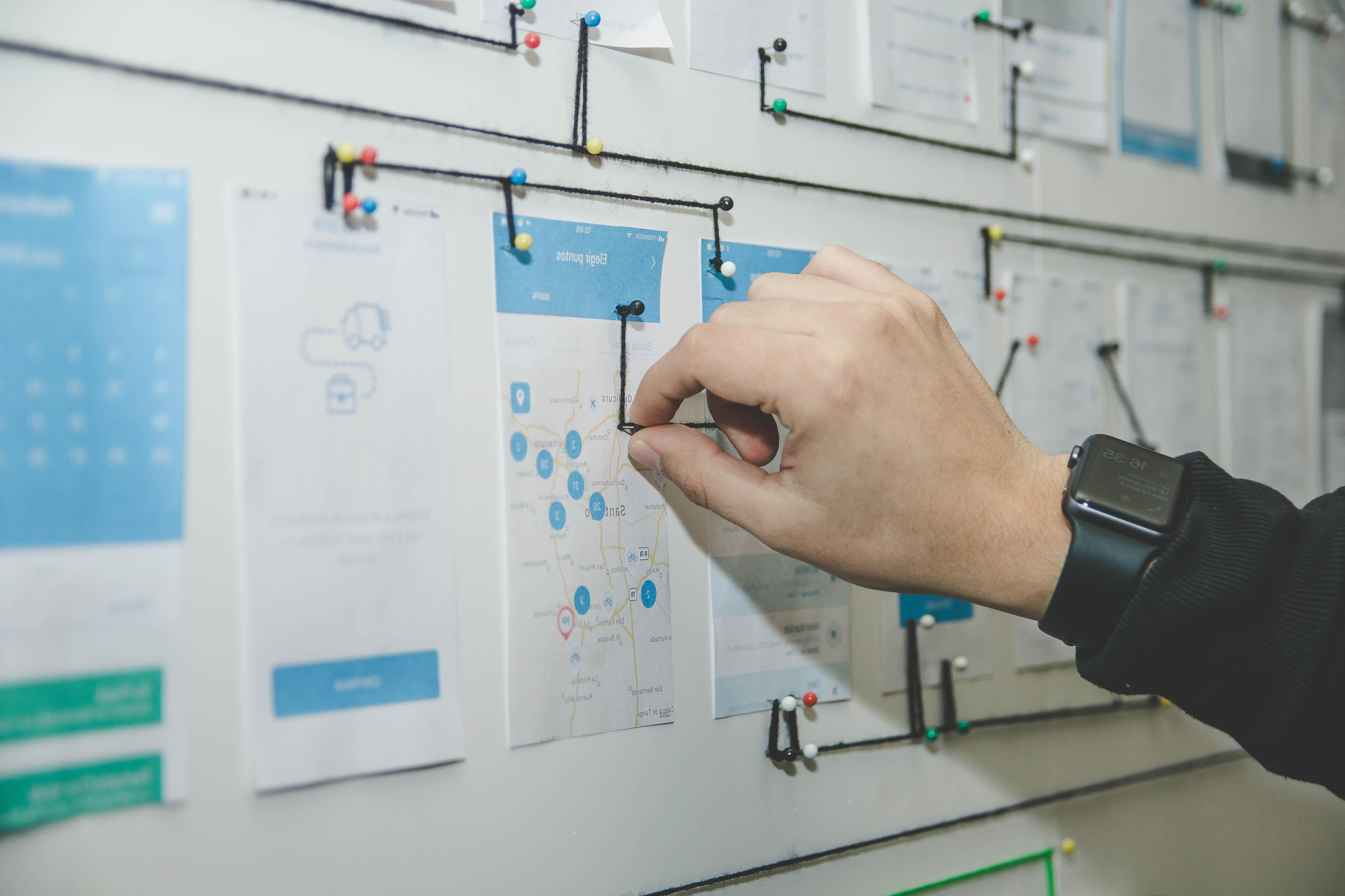 photo of a hand working on a design board