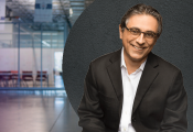 photo of man sitting in warehouse