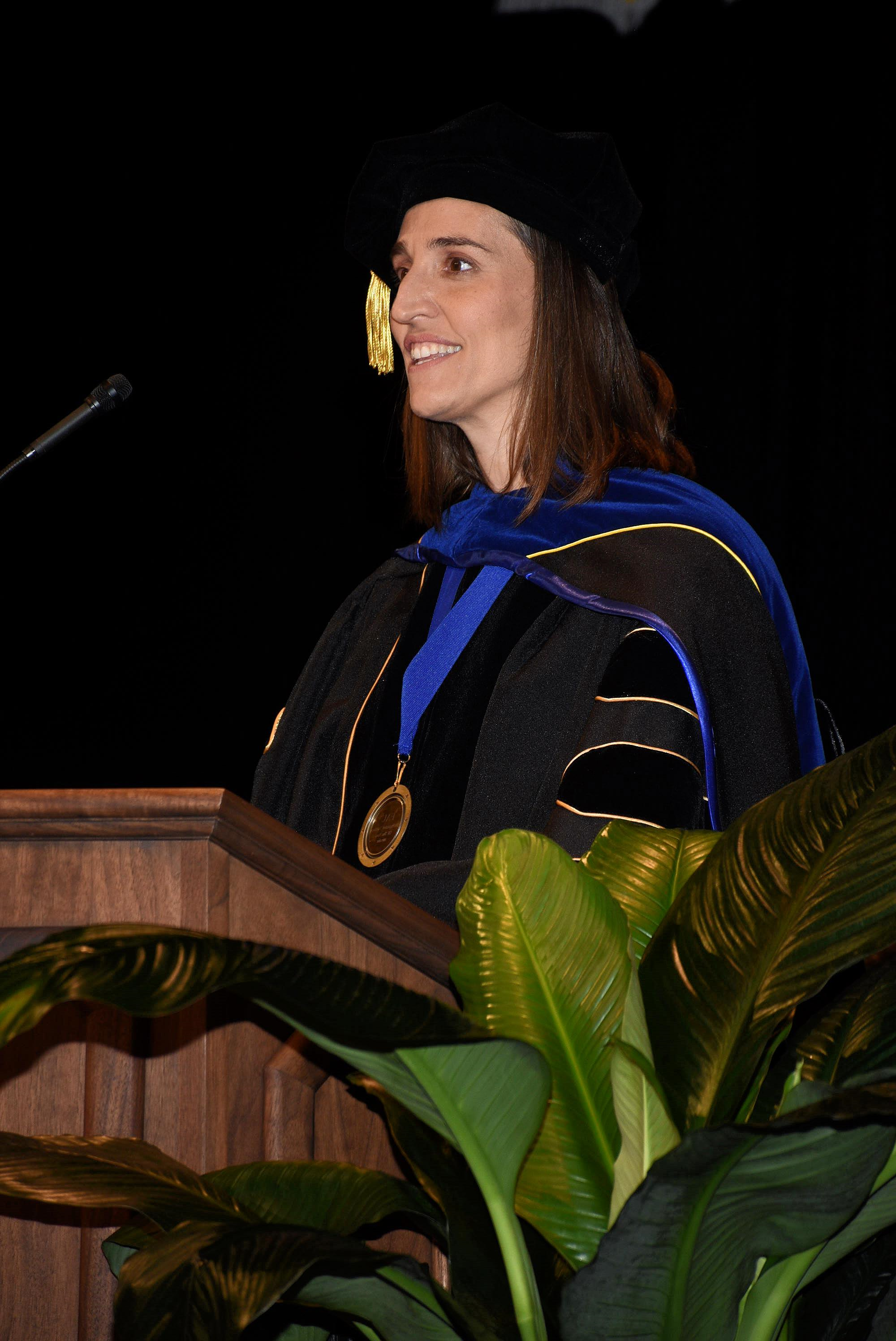 Dr.Laura Vernon speaking at convocation at the podium